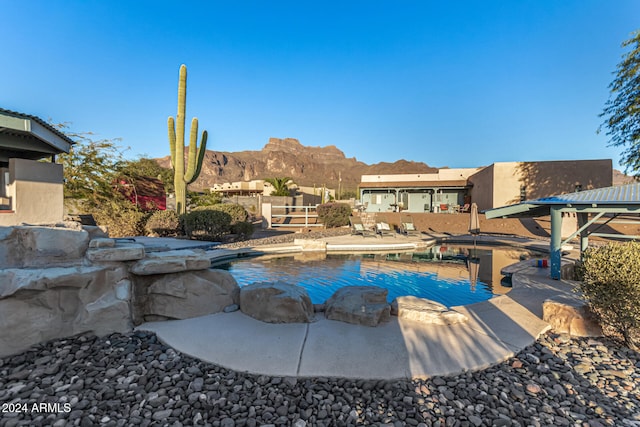 view of pool featuring a mountain view and a patio area