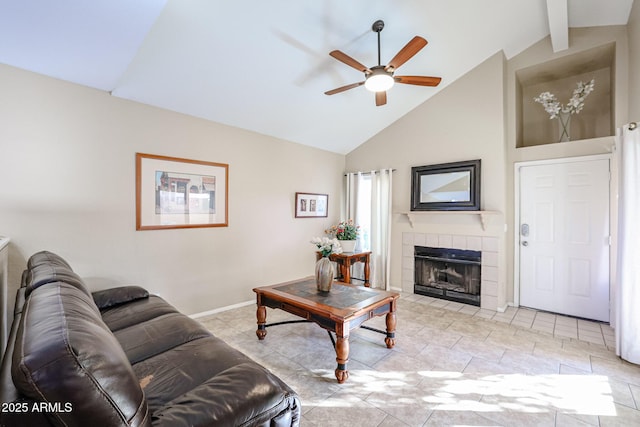 living room featuring ceiling fan, beam ceiling, a fireplace, and high vaulted ceiling