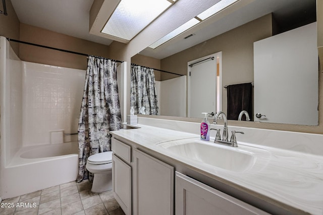 full bathroom featuring tile patterned flooring, vanity, toilet, and shower / bathtub combination with curtain