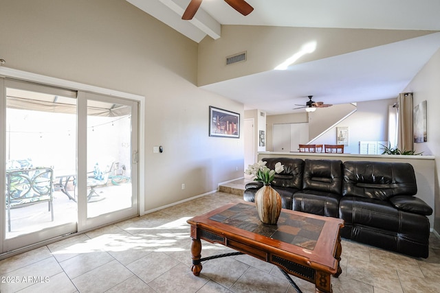 tiled living room featuring ceiling fan, beam ceiling, and high vaulted ceiling