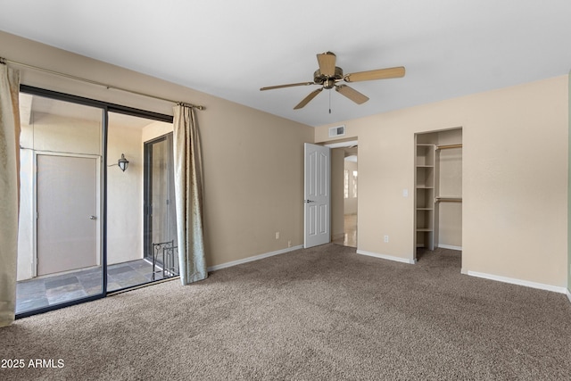 3235 E Camelback Rd Unit 124, Phoenix, AZ 85018 - unfurnished bedroom featuring carpet, baseboards, and ceiling fan