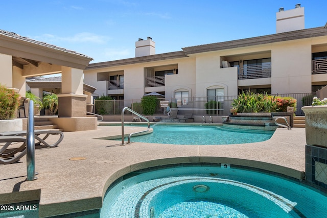 3235 E Camelback Rd Unit 124, Phoenix, AZ 85018 - community pool featuring a hot tub and a patio area