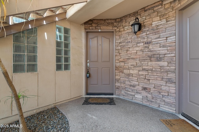 3235 E Camelback Rd Unit 124, Phoenix, AZ 85018 - view of exterior entry featuring stone siding