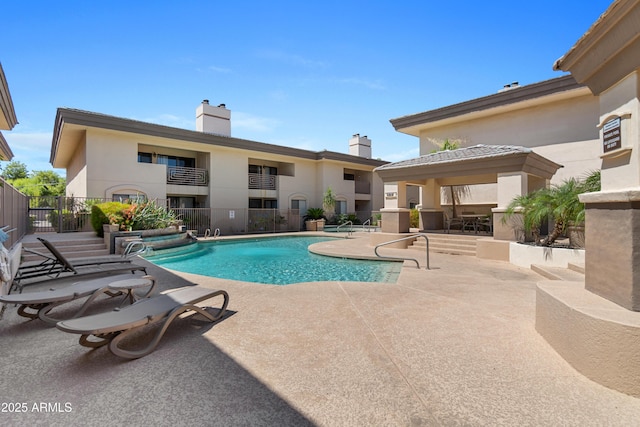 3235 E Camelback Rd Unit 124, Phoenix, AZ 85018 - community pool featuring a patio area