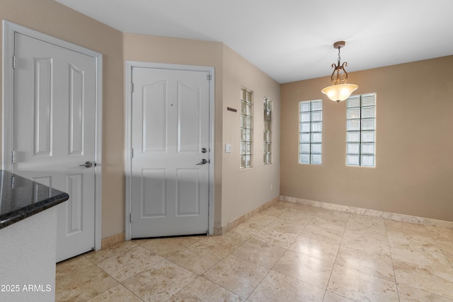 3235 E Camelback Rd Unit 124, Phoenix, AZ 85018 - foyer entrance with baseboards and light tile patterned floors