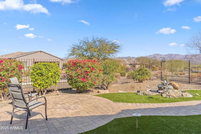 view of patio / terrace with a mountain view