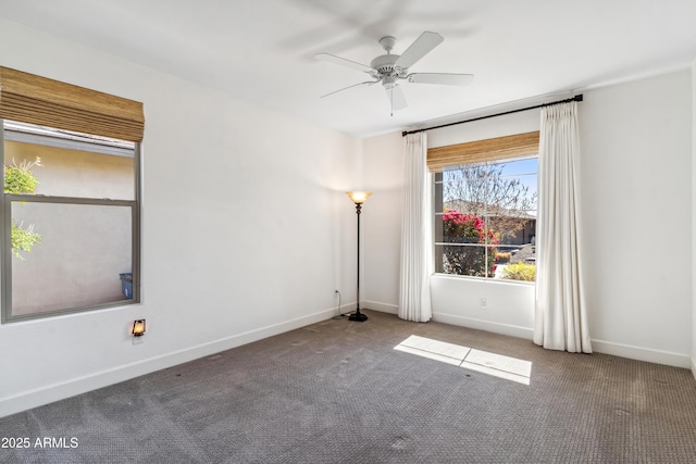 empty room with ceiling fan and carpet