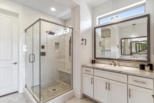 bathroom with vanity and walk in shower