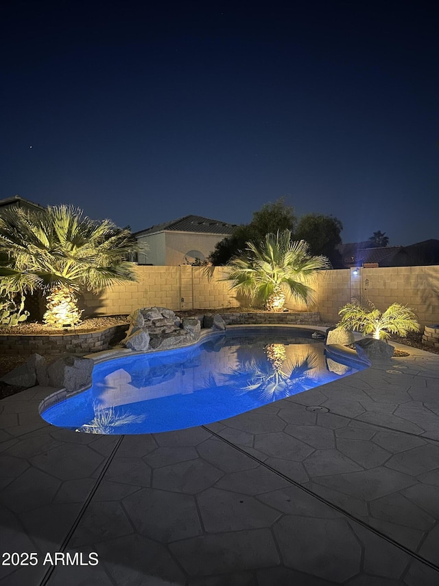 9662 W Sunnyslope Ln, Peoria, AZ 85345 - pool at twilight with a fenced backyard and a patio