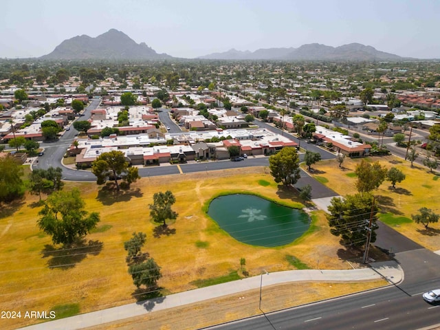 birds eye view of property featuring a water and mountain view