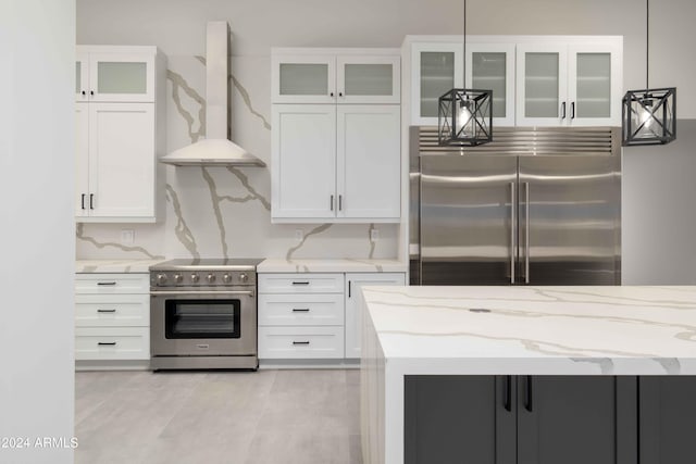 kitchen featuring white cabinets, ventilation hood, stainless steel appliances, and light stone countertops