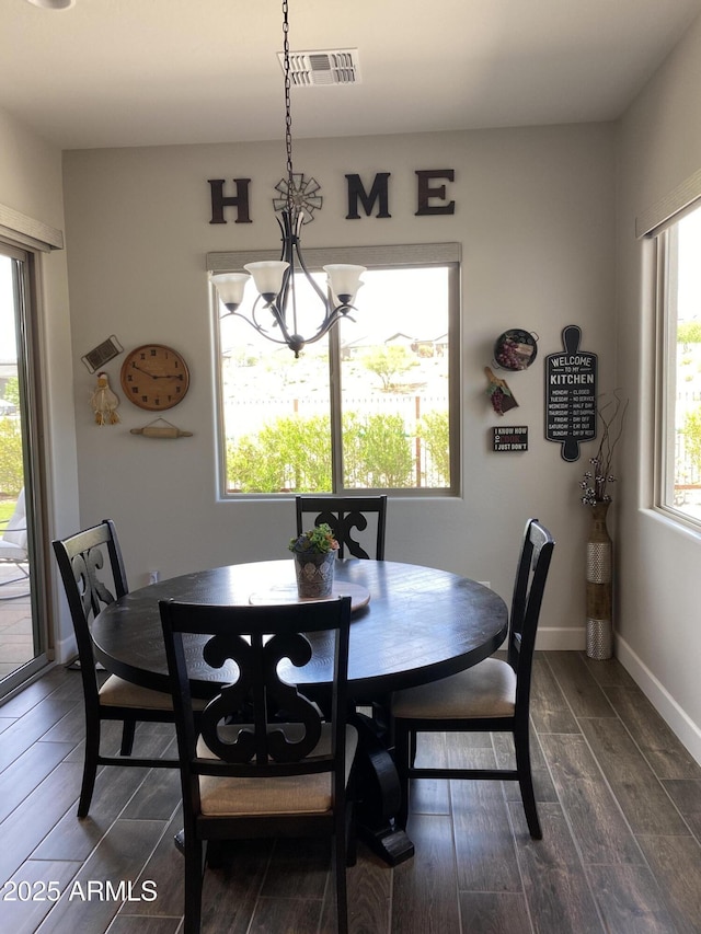 4114 Copperhead Dr, Wickenburg, AZ 85390 - dining room with dark wood-type flooring, a chandelier, and baseboards