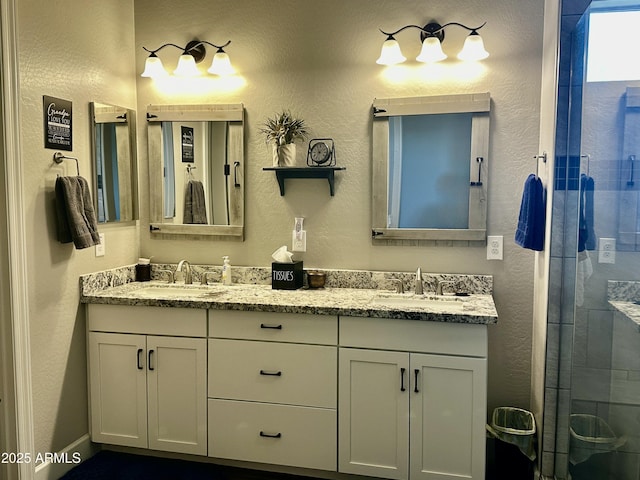 4114 Copperhead Dr, Wickenburg, AZ 85390 - bathroom with double vanity, a stall shower, and a textured wall