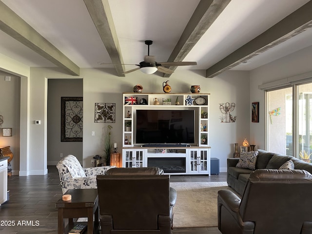 4114 Copperhead Dr, Wickenburg, AZ 85390 - living room with beam ceiling, a ceiling fan, dark wood-style flooring, and baseboards