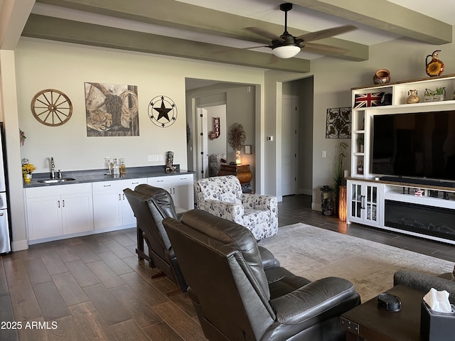 4114 Copperhead Dr, Wickenburg, AZ 85390 - living area with bar with sink, beamed ceiling, ceiling fan, and dark wood finished floors