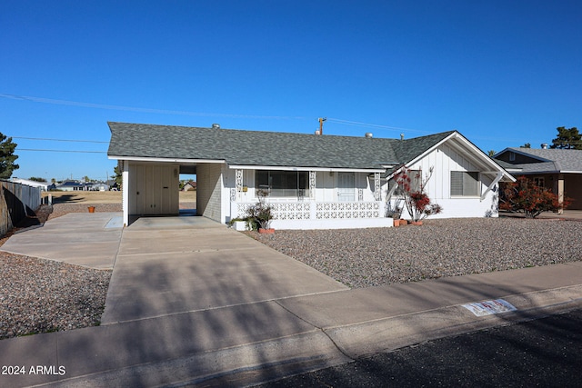 single story home with a carport