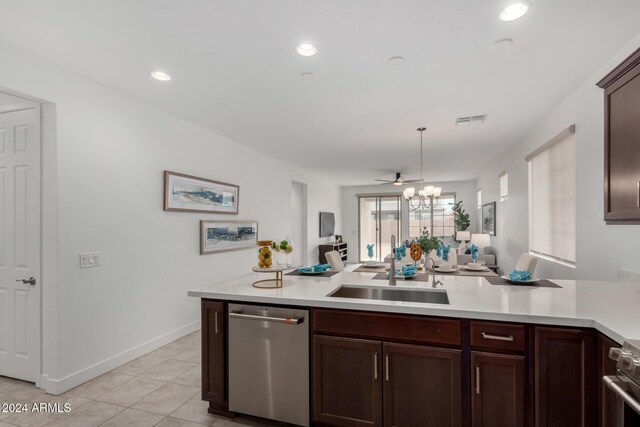 kitchen with sink, ceiling fan, light tile patterned floors, decorative light fixtures, and stainless steel appliances