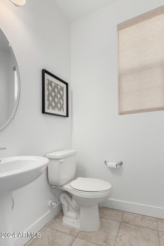 bathroom featuring tile patterned floors and toilet