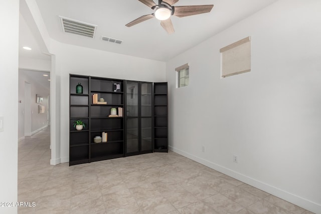 empty room featuring ceiling fan