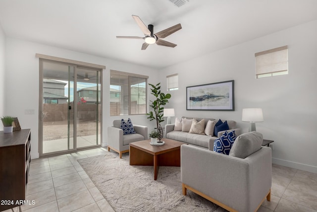 tiled living room with ceiling fan