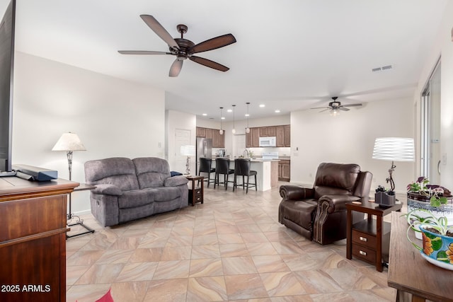 living room with ceiling fan