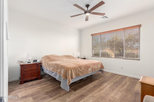 bedroom featuring ceiling fan and light hardwood / wood-style flooring