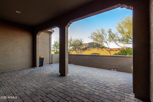 view of patio with a mountain view