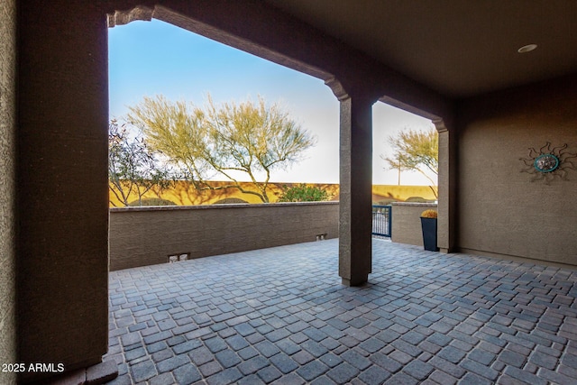 view of patio terrace at dusk