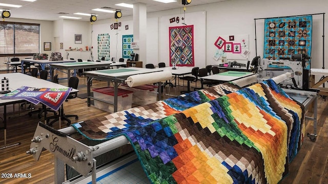 recreation room featuring a drop ceiling