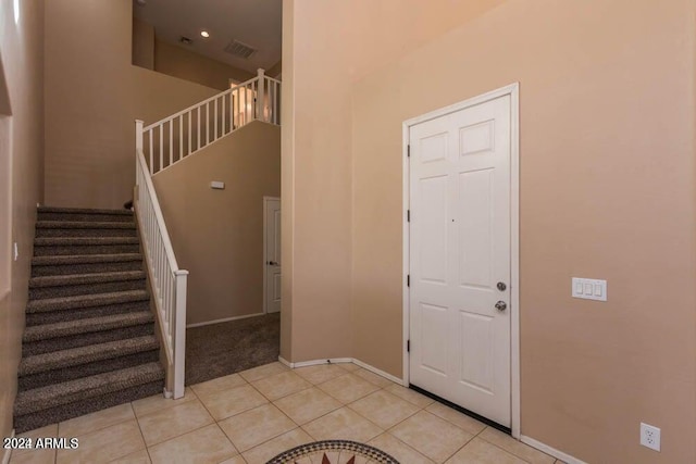 foyer featuring light tile patterned floors