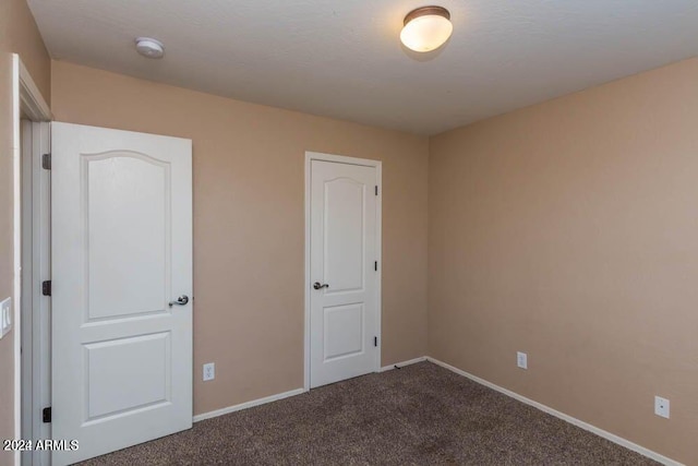 spare room with carpet floors