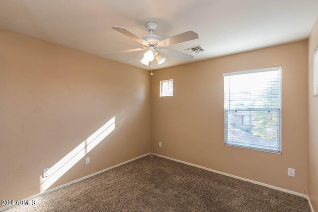 empty room with carpet flooring and ceiling fan