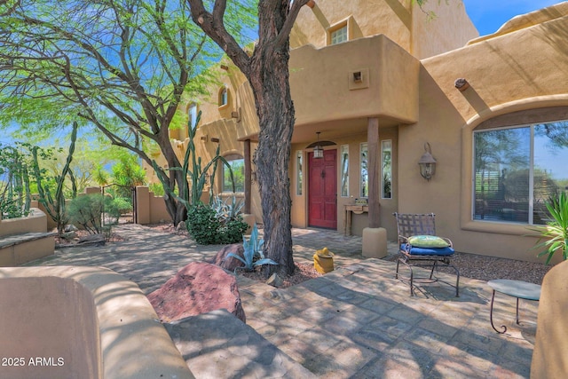 6310 E Dove Valley Rd, Cave Creek, AZ 85331 - view of exterior entry featuring stucco siding and a patio area