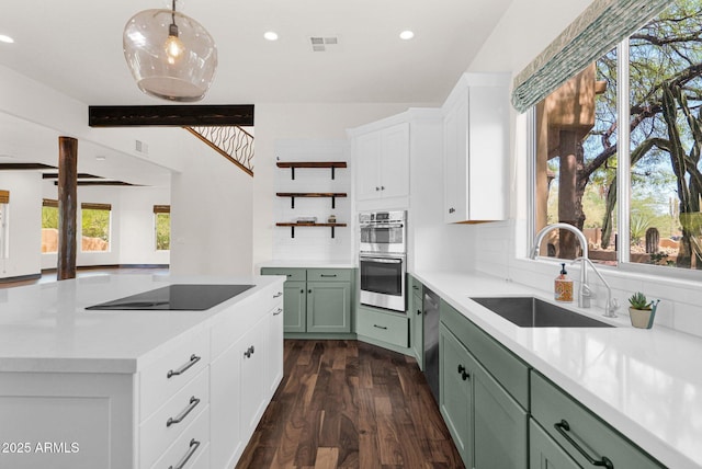 6310 E Dove Valley Rd, Cave Creek, AZ 85331 - kitchen with green cabinets, stainless steel appliances, healthy amount of natural light, recessed lighting, and light countertops