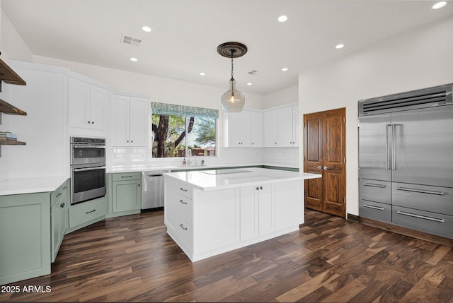 6310 E Dove Valley Rd, Cave Creek, AZ 85331 - kitchen with appliances with stainless steel finishes, open shelves, dark wood finished floors, light countertops, and recessed lighting