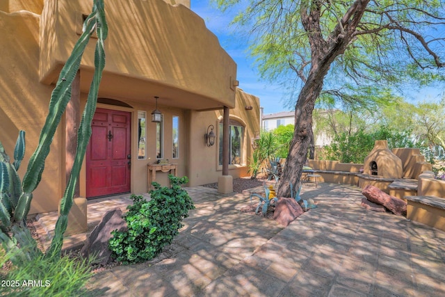 6310 E Dove Valley Rd, Cave Creek, AZ 85331 - view of patio / terrace featuring an outdoor stone fireplace