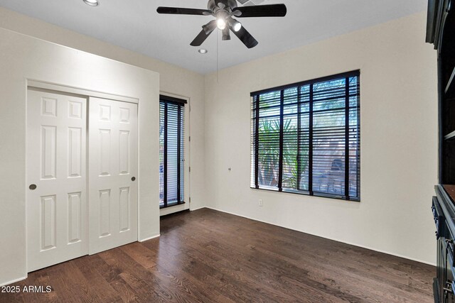 6310 E Dove Valley Rd, Cave Creek, AZ 85331 - unfurnished bedroom with dark wood-type flooring, recessed lighting, a closet, and ceiling fan