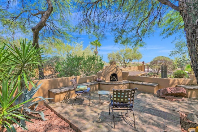 6310 E Dove Valley Rd, Cave Creek, AZ 85331 - view of patio / terrace featuring an outdoor stone fireplace