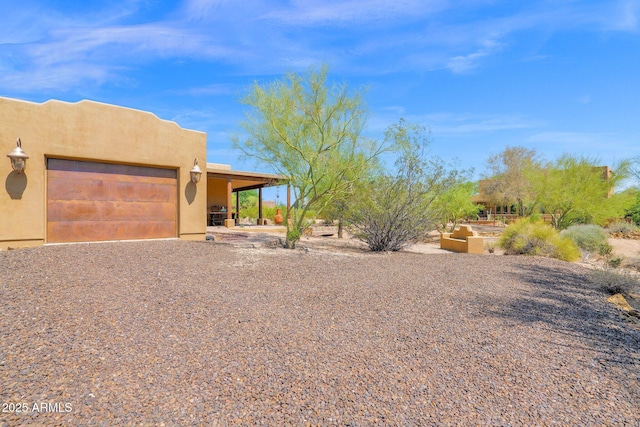 6310 E Dove Valley Rd, Cave Creek, AZ 85331 - pueblo-style house featuring stucco siding and an attached garage