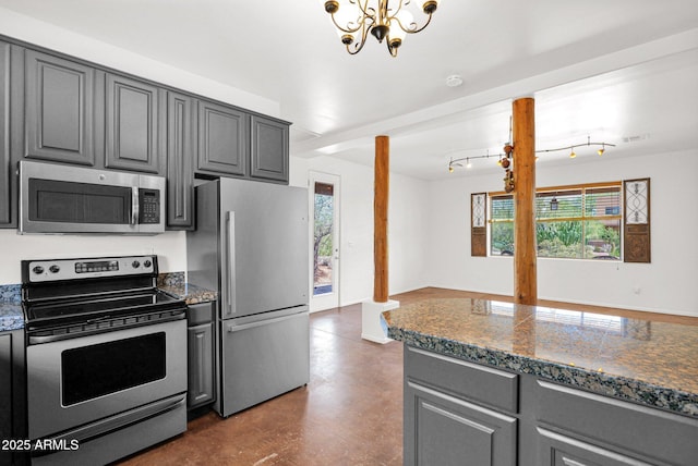 6310 E Dove Valley Rd, Cave Creek, AZ 85331 - kitchen with stainless steel appliances, gray cabinets, and a chandelier