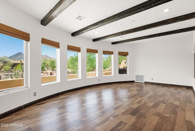 6310 E Dove Valley Rd, Cave Creek, AZ 85331 - unfurnished room featuring healthy amount of natural light, beamed ceiling, wood finished floors, and recessed lighting