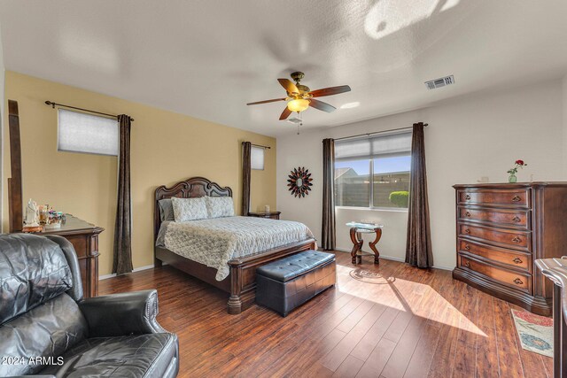 bedroom with dark wood-type flooring and ceiling fan