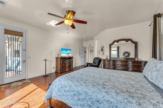 bedroom with wood-type flooring, access to outside, and ceiling fan