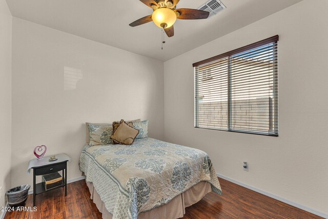 bedroom featuring ceiling fan and dark wood-type flooring