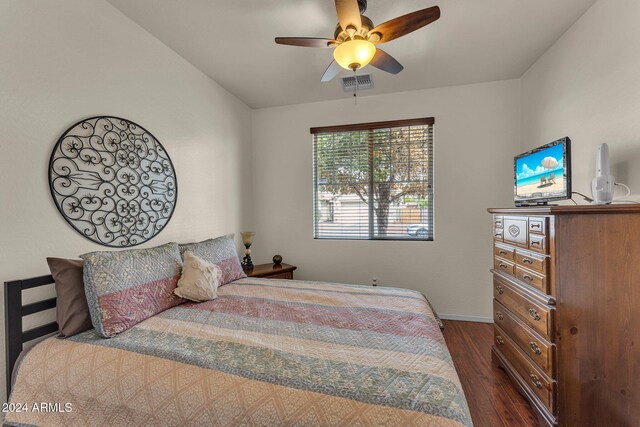 bedroom featuring ceiling fan and dark hardwood / wood-style floors