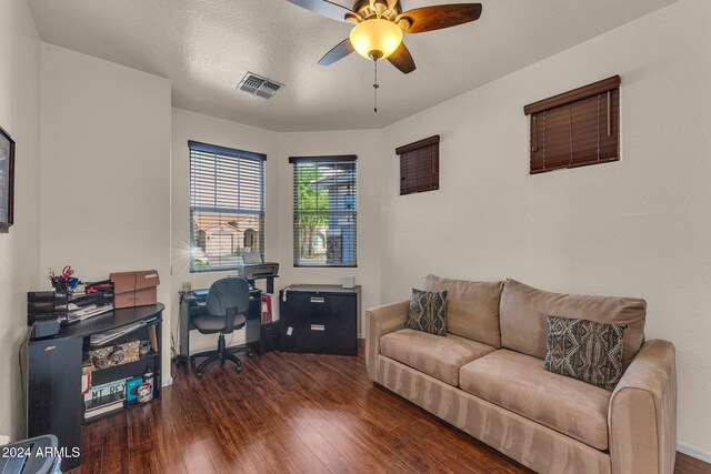 office space featuring ceiling fan, a textured ceiling, and dark hardwood / wood-style floors