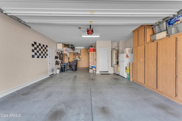 garage featuring a garage door opener and electric water heater