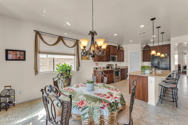 dining area featuring an inviting chandelier