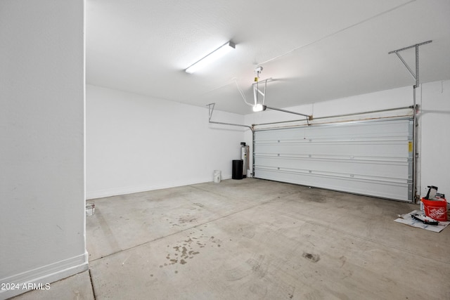 garage with baseboards and a garage door opener