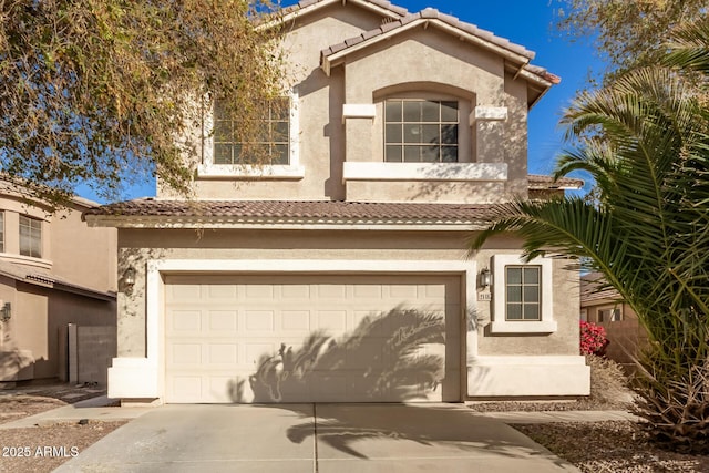 mediterranean / spanish-style house featuring a garage